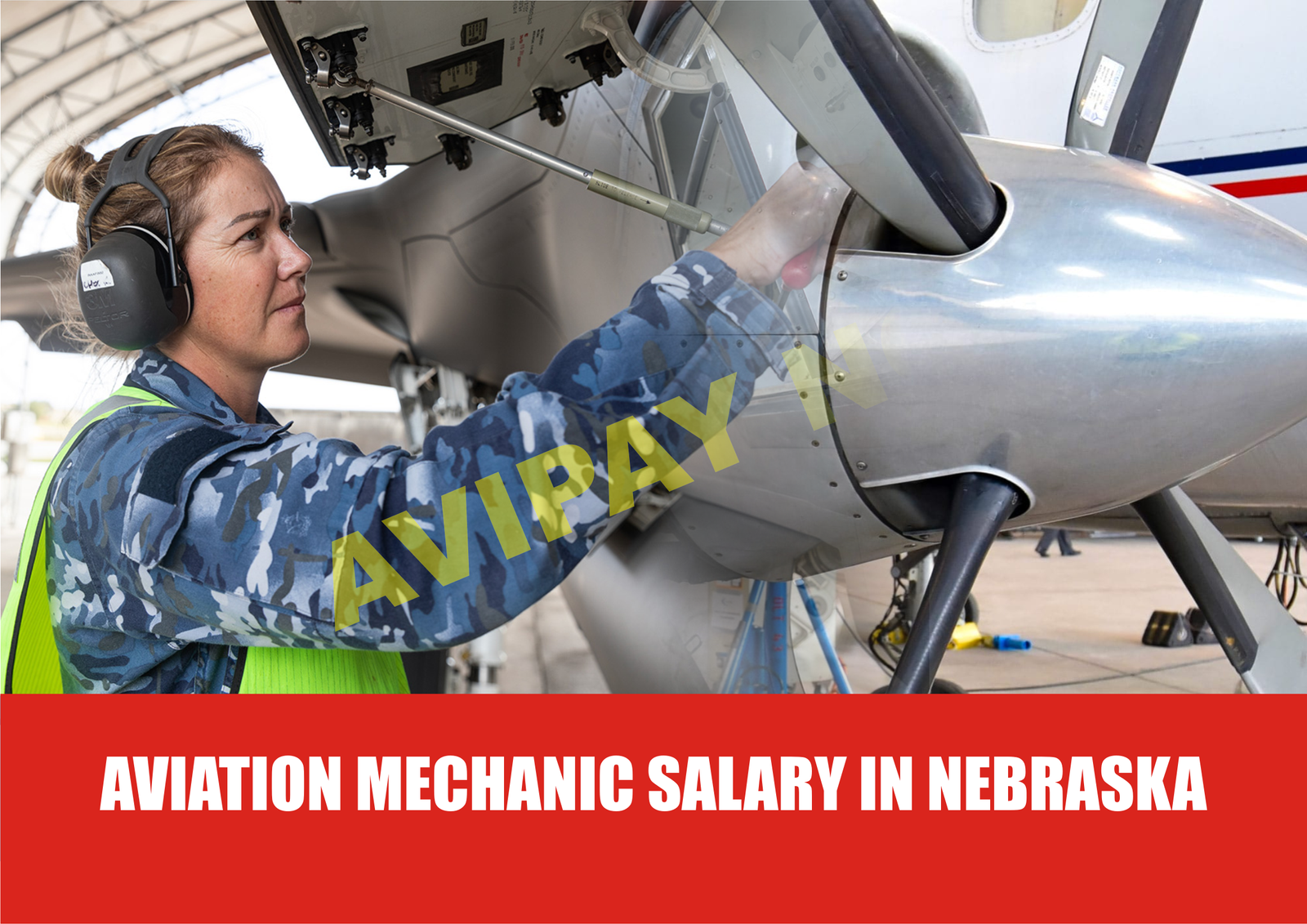 Photo of an aviation mechanic in Nebraska working on a helicopter